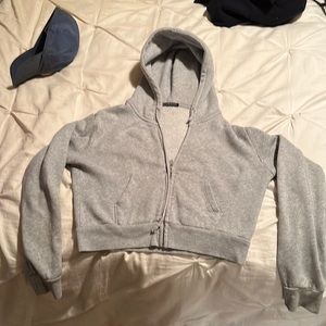 Brandy Melville cropped grey hoodie.
